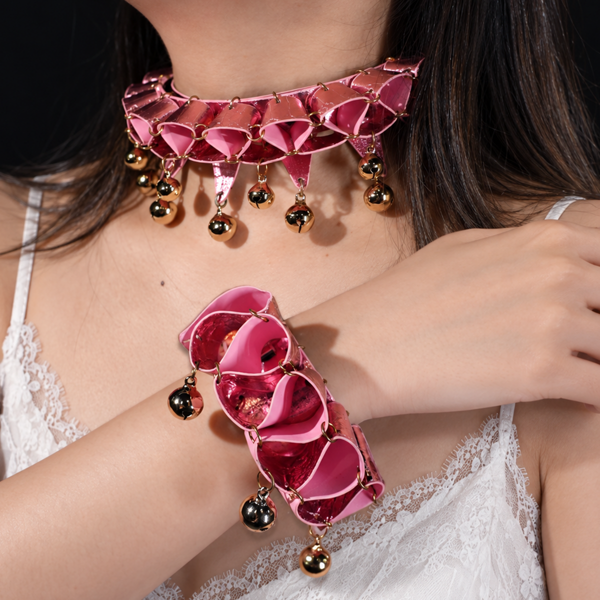 Pink Jester Duo choker and wrist cuff worn by a model